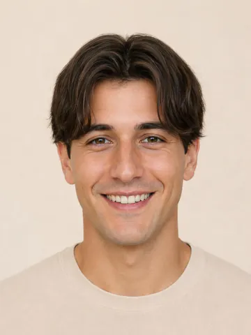 Men’s curtains haircut with a center part, front view